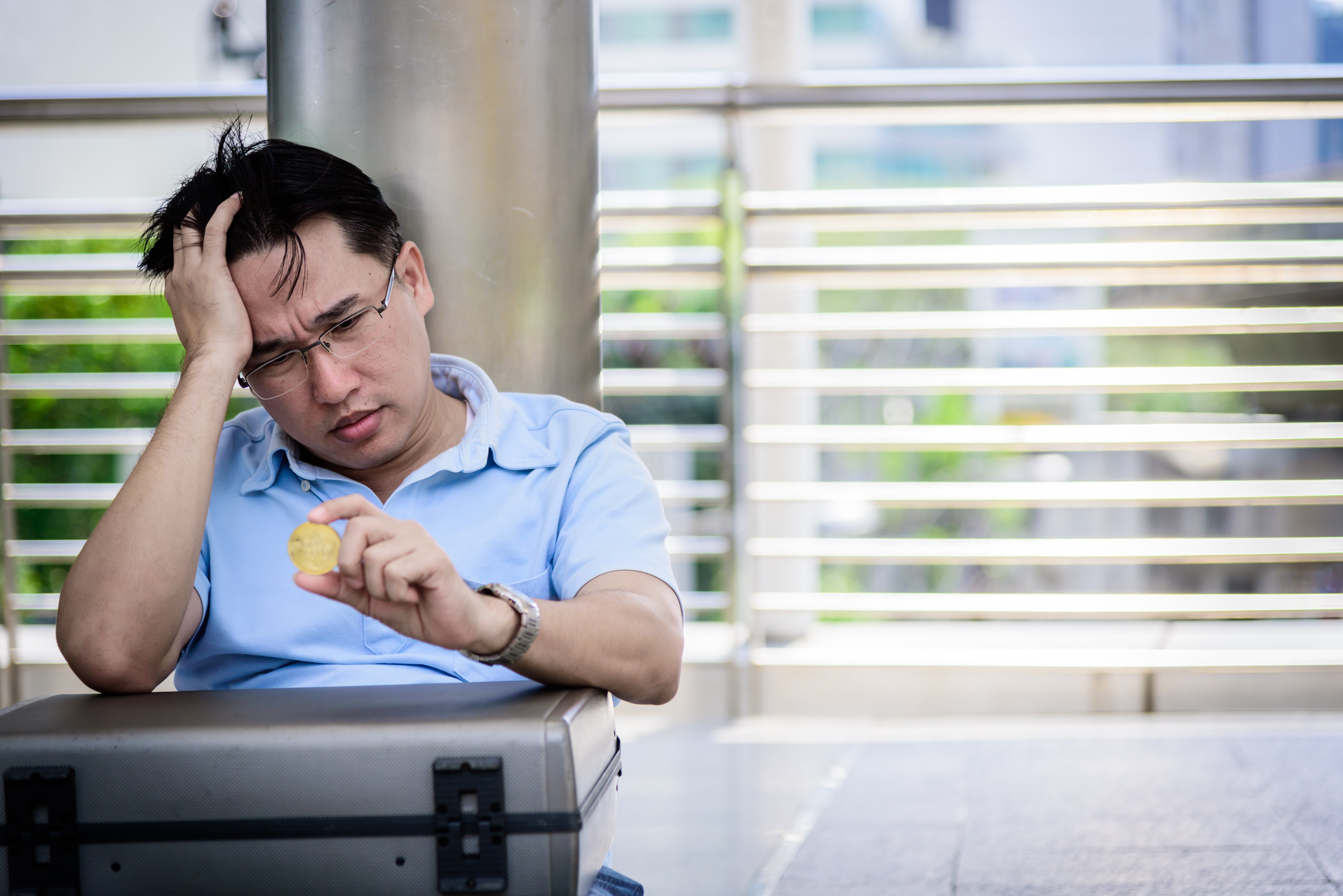 adisn-business-man-sitting-in-depression-with-bit-2026-01-11-09-43-42-utc