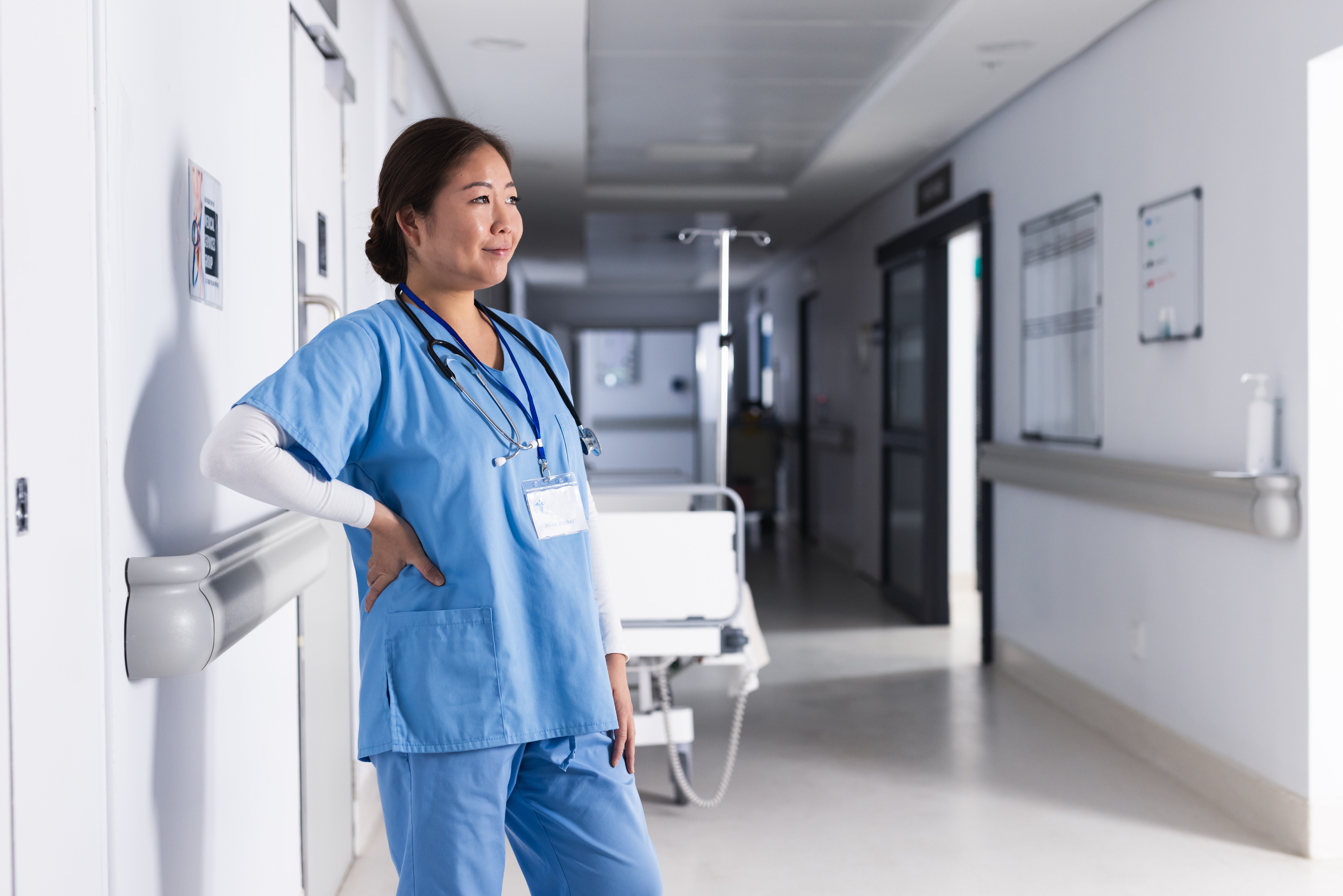 asian-female-doctor-with-stethoscope-standing-in-h-2026-01-09-08-41-25-utc