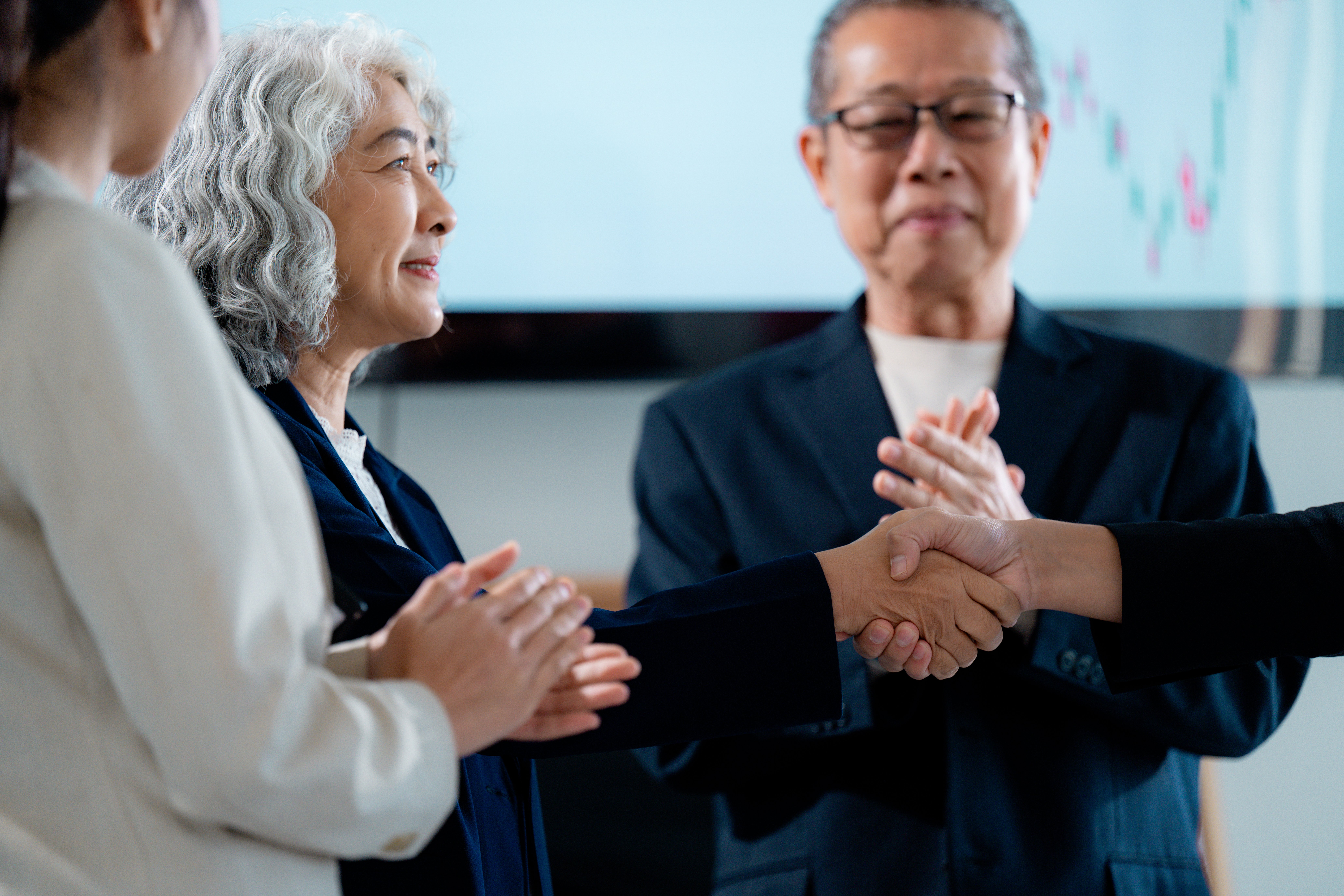 businesswomen-shaking-hands-after-closing-a-deal-i-2026-01-09-09-52-54-utc