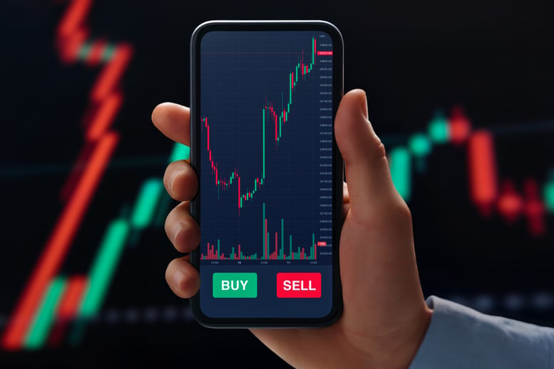 investor-holds-phone-displaying-trading-applicatio-2026-01-09-10-12-49-utc
