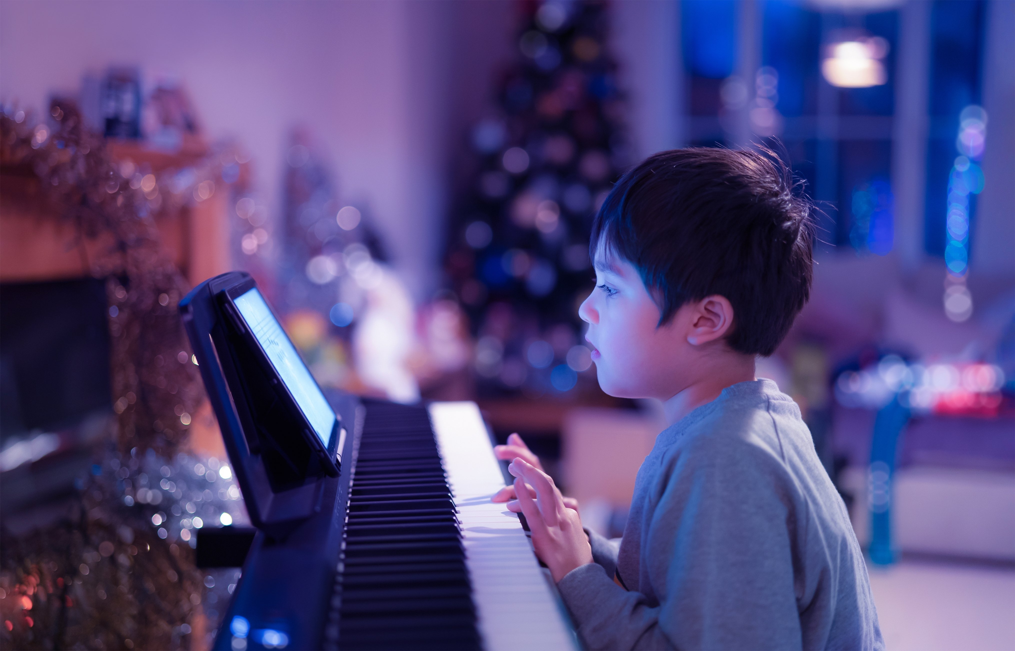 kid-playing-piano-with-neon-lights-young-boy-lear-2026-03-19-07-06-53-utc