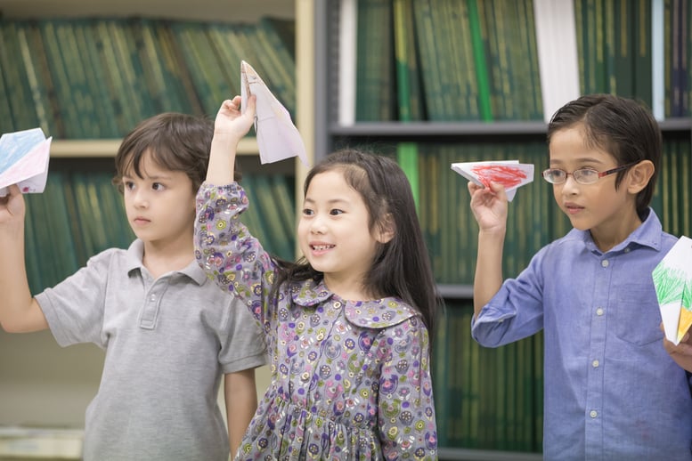 portrait-of-children-playing-airplane-at-classroom-2026-01-11-09-06-38-utc