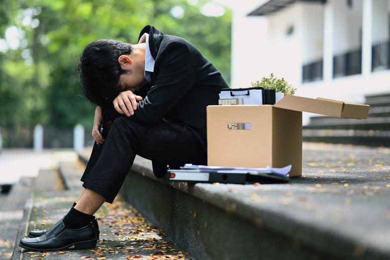 sad-upset-businessman-sitting-hopelessly-on-stair-2026-03-13-04-39-05-utc