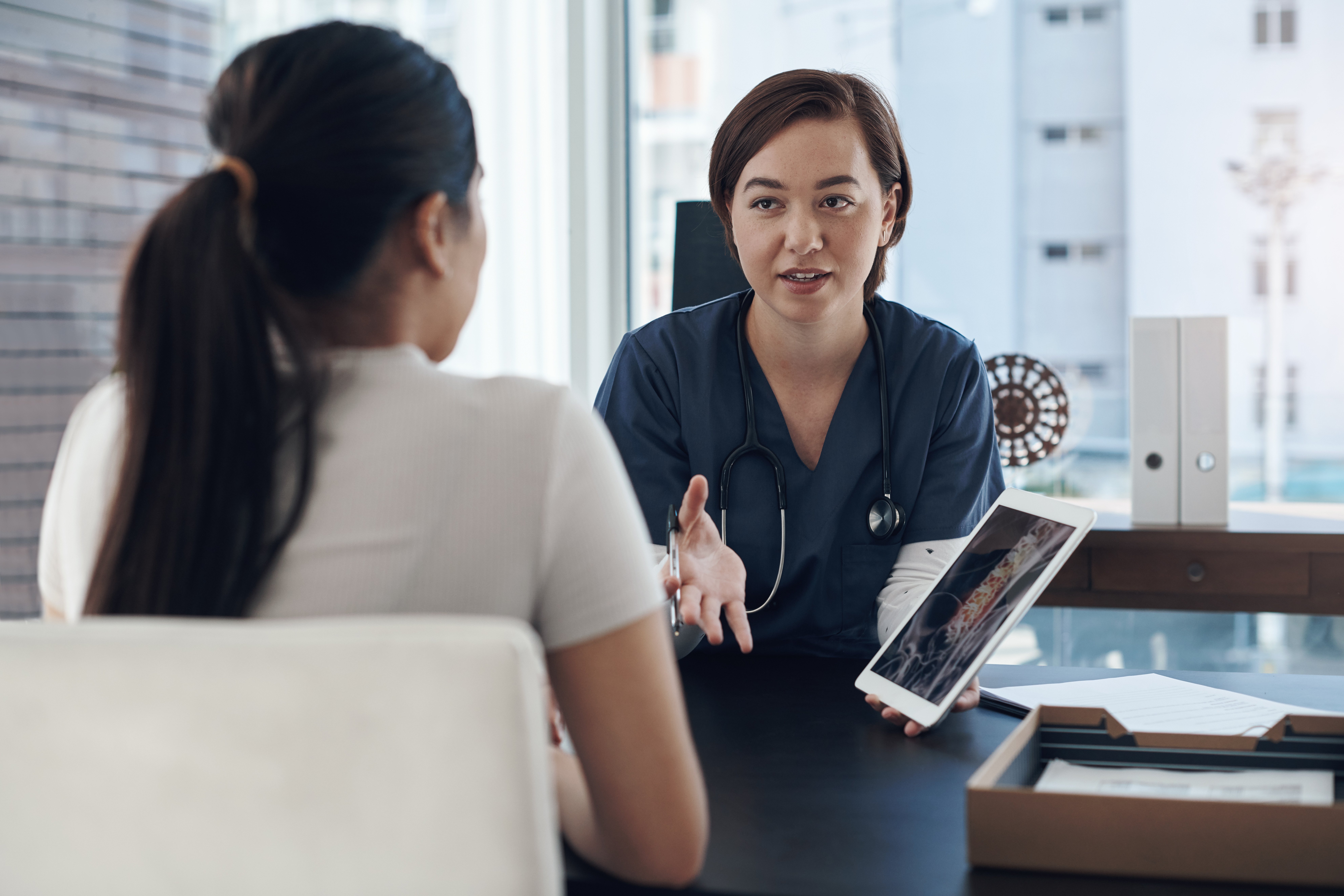 shot-of-a-young-female-doctor-showing-a-patient-a-2026-01-09-10-34-37-utc