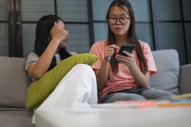 two-asian-teenager-female-friends-are-looking-at-p-2026-03-05-05-20-01-utc
